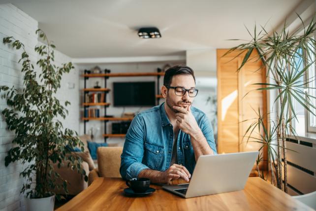 portrait-of-a-casual-businessman-thinking-while-lo-2023-11-27-04-50-34-utc-scaled