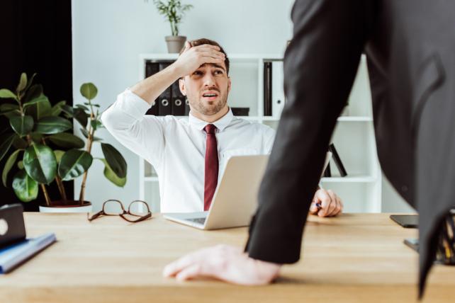 scared-businessman-with-laptop-l