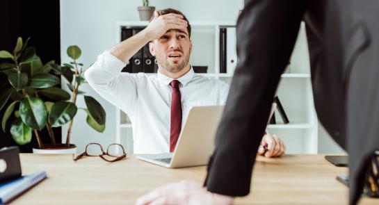 scared-businessman-with-laptop-l